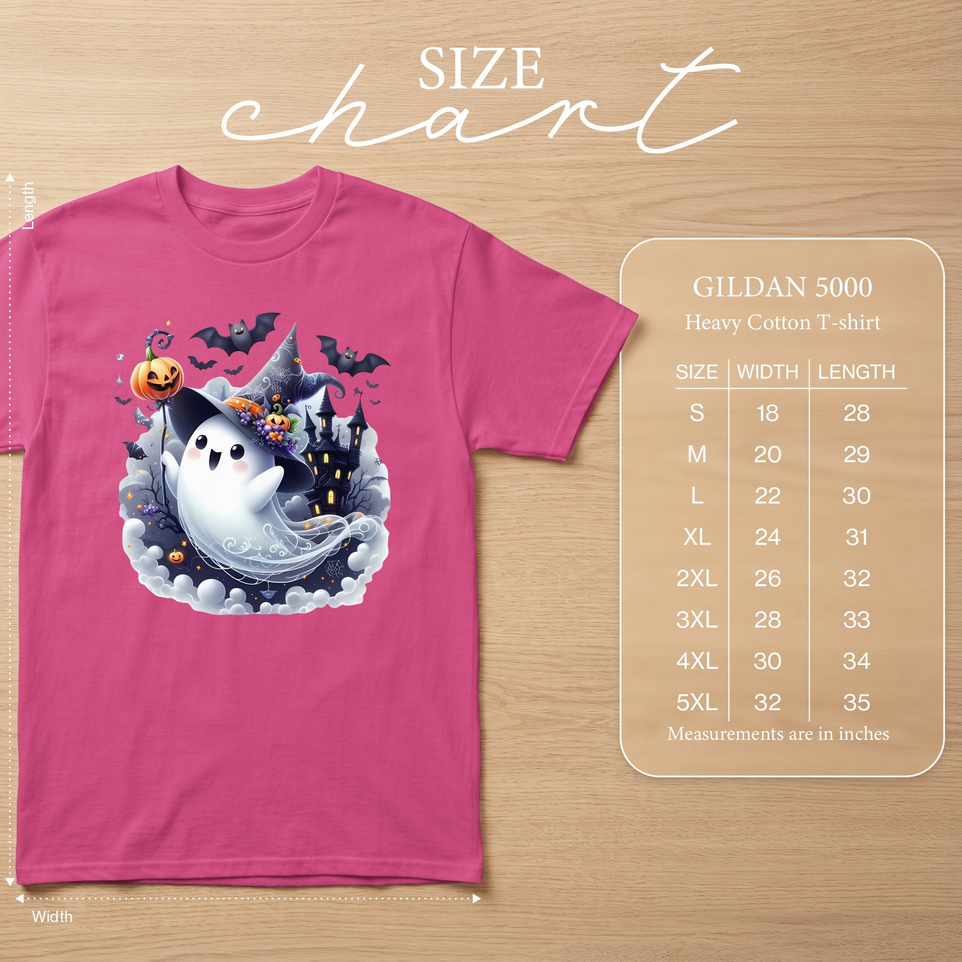 Pink Gildan 5000 t-shirt with ghost and castle Halloween graphic, includes size chart.