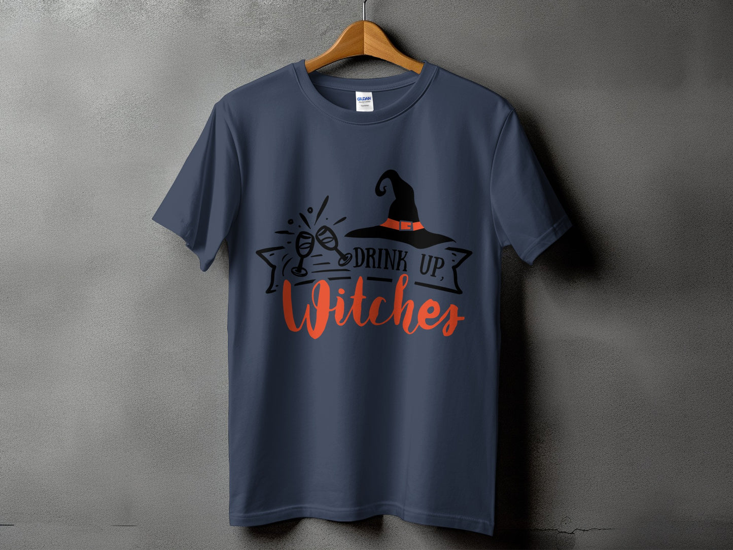 Dark blue t-shirt with "Drink Up, Witches" text and witch hat graphic.