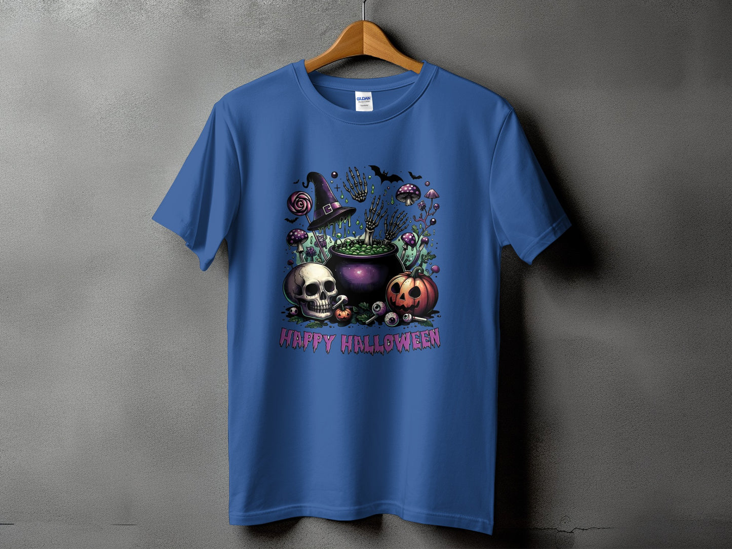 Blue t-shirt with Halloween graphic featuring skull, pumpkin, cauldron, witch hat, and text.