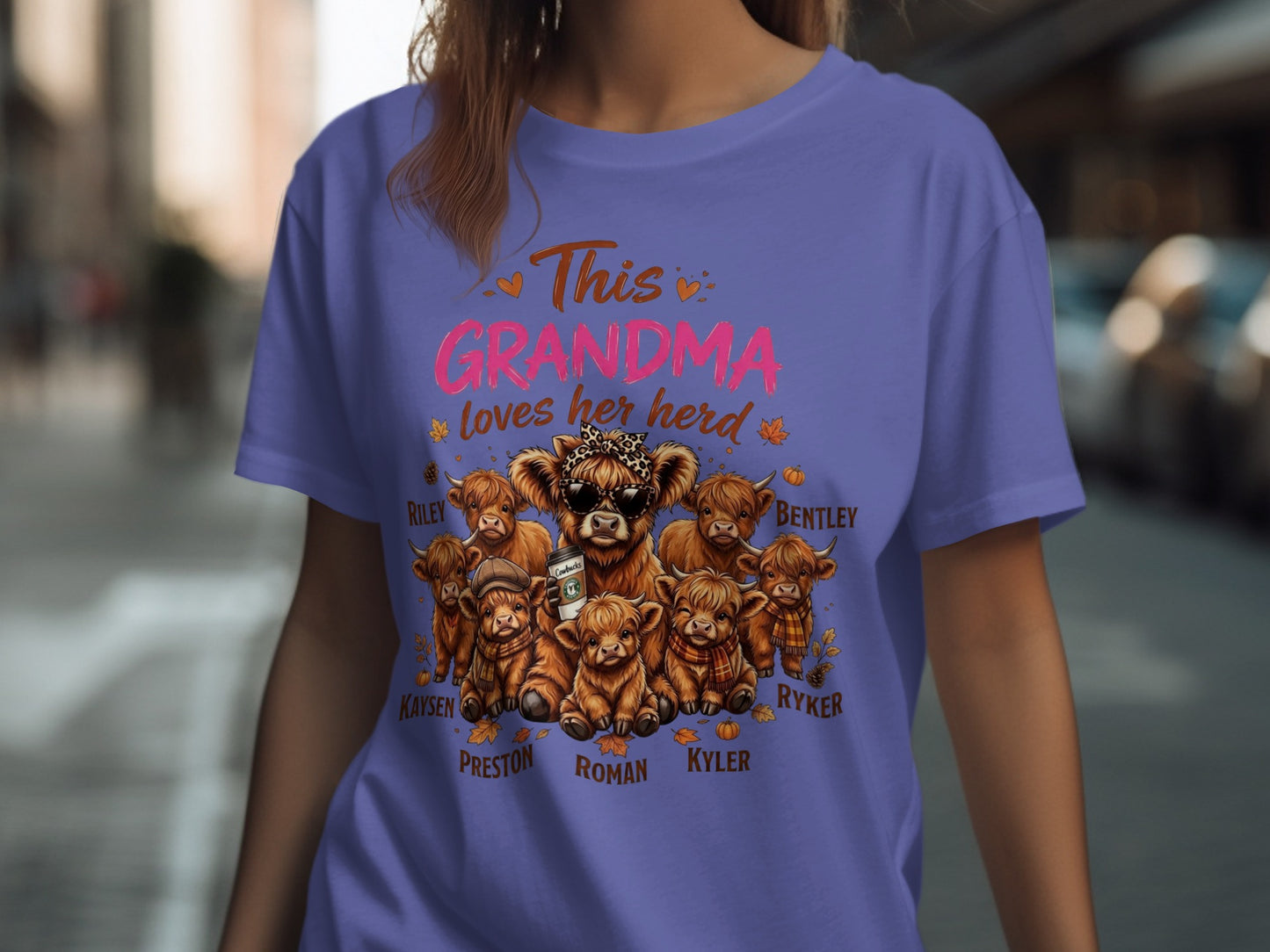 T-shirt with "This Grandma loves her herd" and cartoon cows with names.