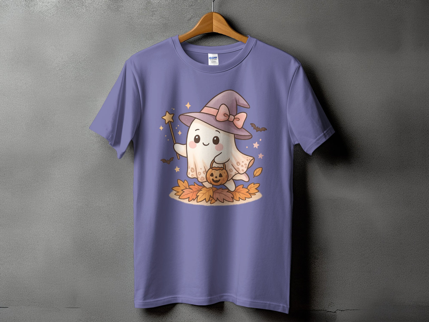 Purple t-shirt with a cute ghost wearing a witch hat, holding a wand and pumpkin basket.