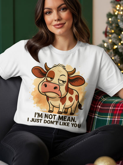 White t-shirt with grumpy cartoon cow and text "I'M NOT MEAN, I JUST DON'T LIKE YOU".