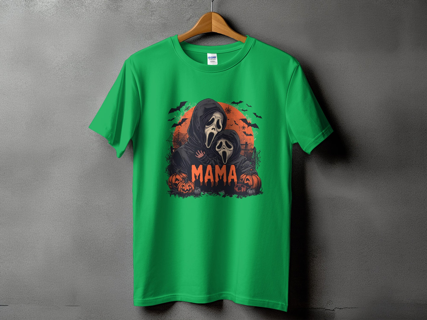 Green t-shirt with "Mama" text and spooky ghost characters with pumpkins.