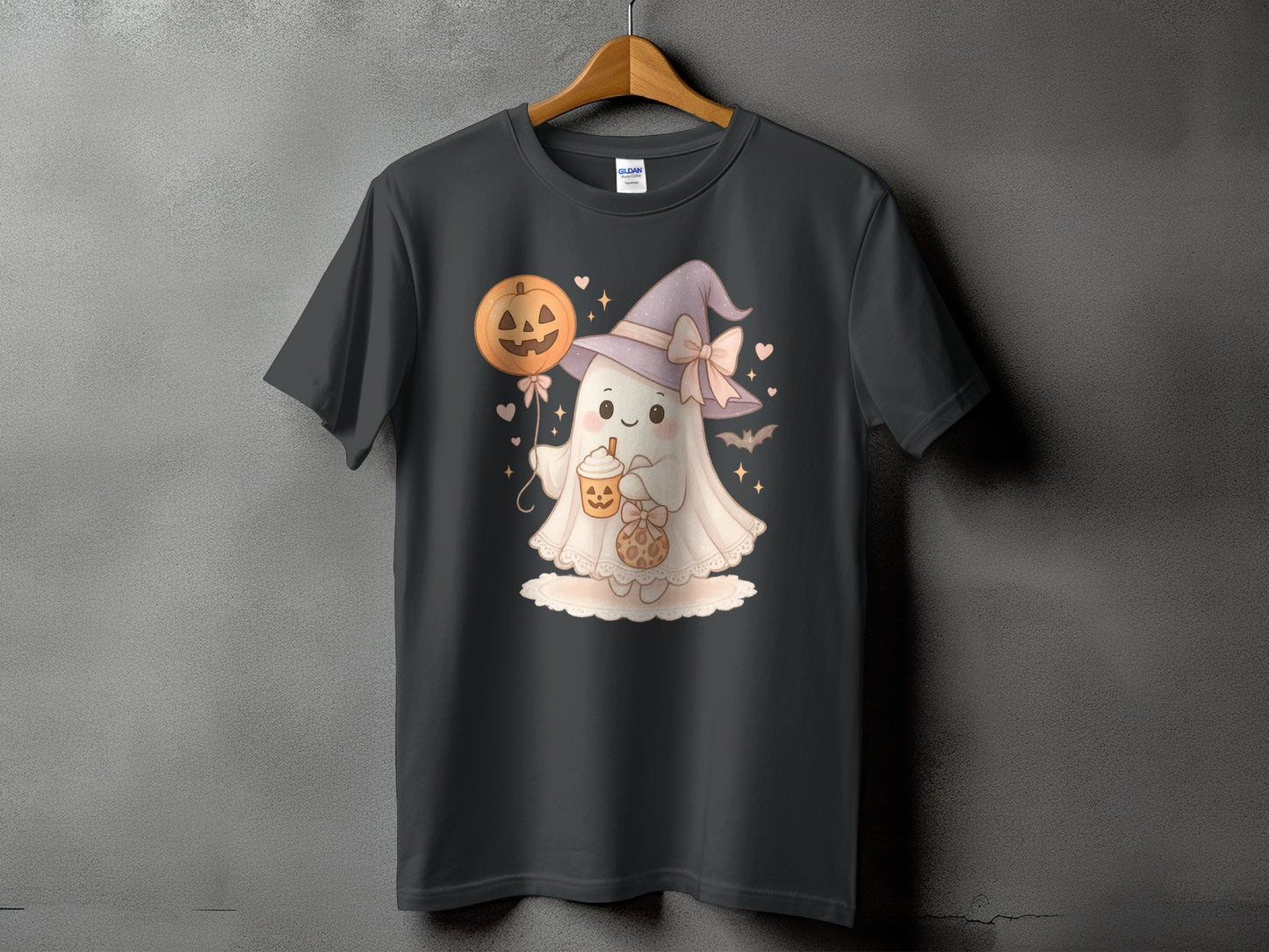 Dark t-shirt with a cute ghost in a witch hat holding a pumpkin balloon and a drink.