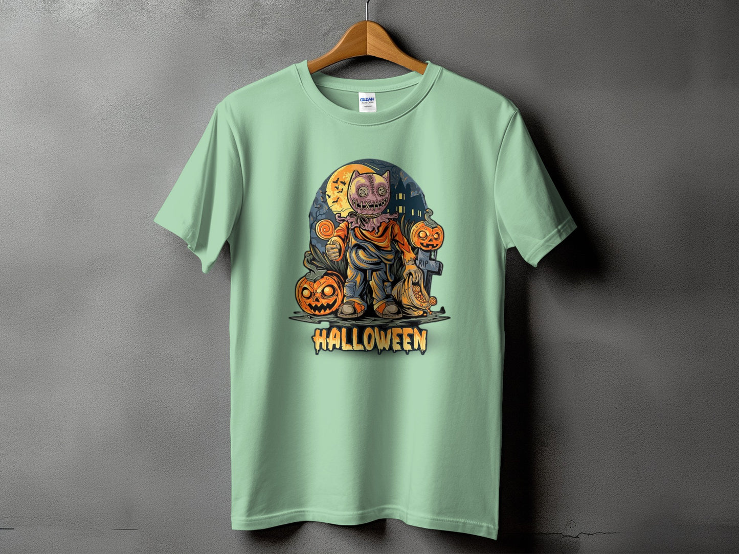 Light green t-shirt featuring a Halloween character with pumpkins and bats.
