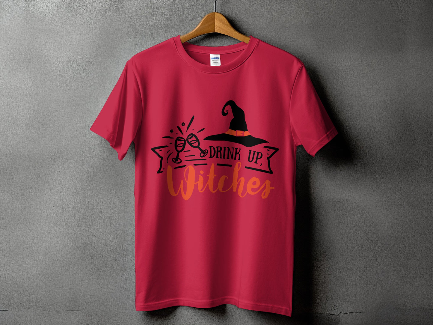 Red t-shirt with a Halloween design featuring a witch hat and text.
