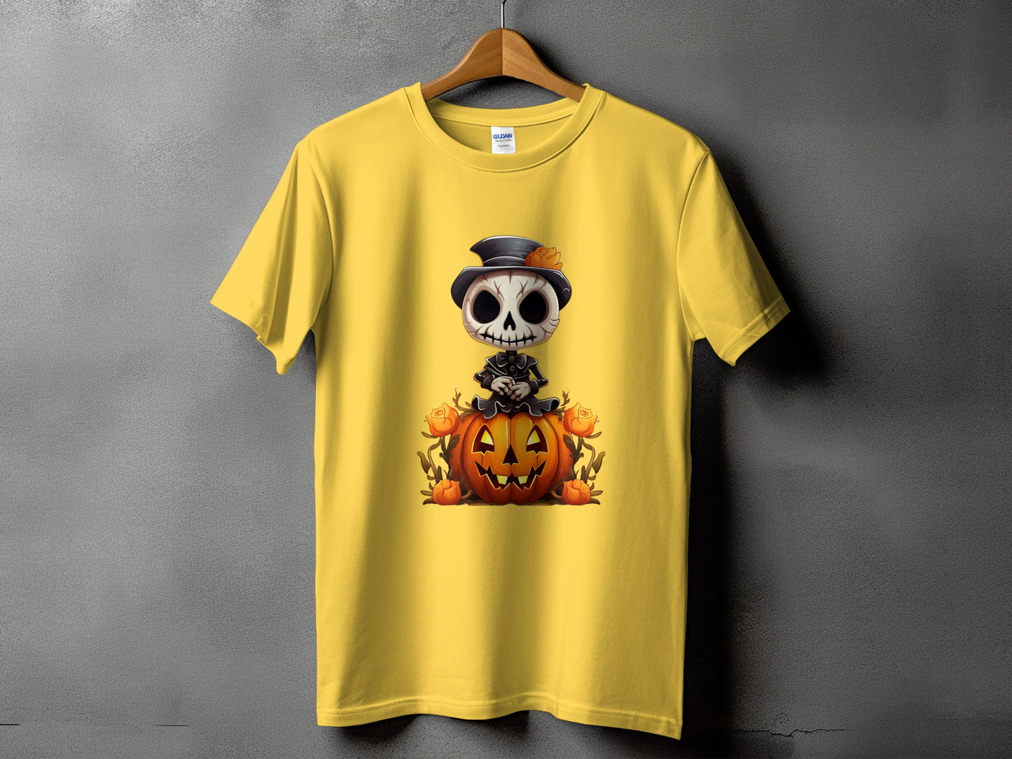 Yellow t-shirt with skeleton character sitting on a pumpkin, surrounded by roses.