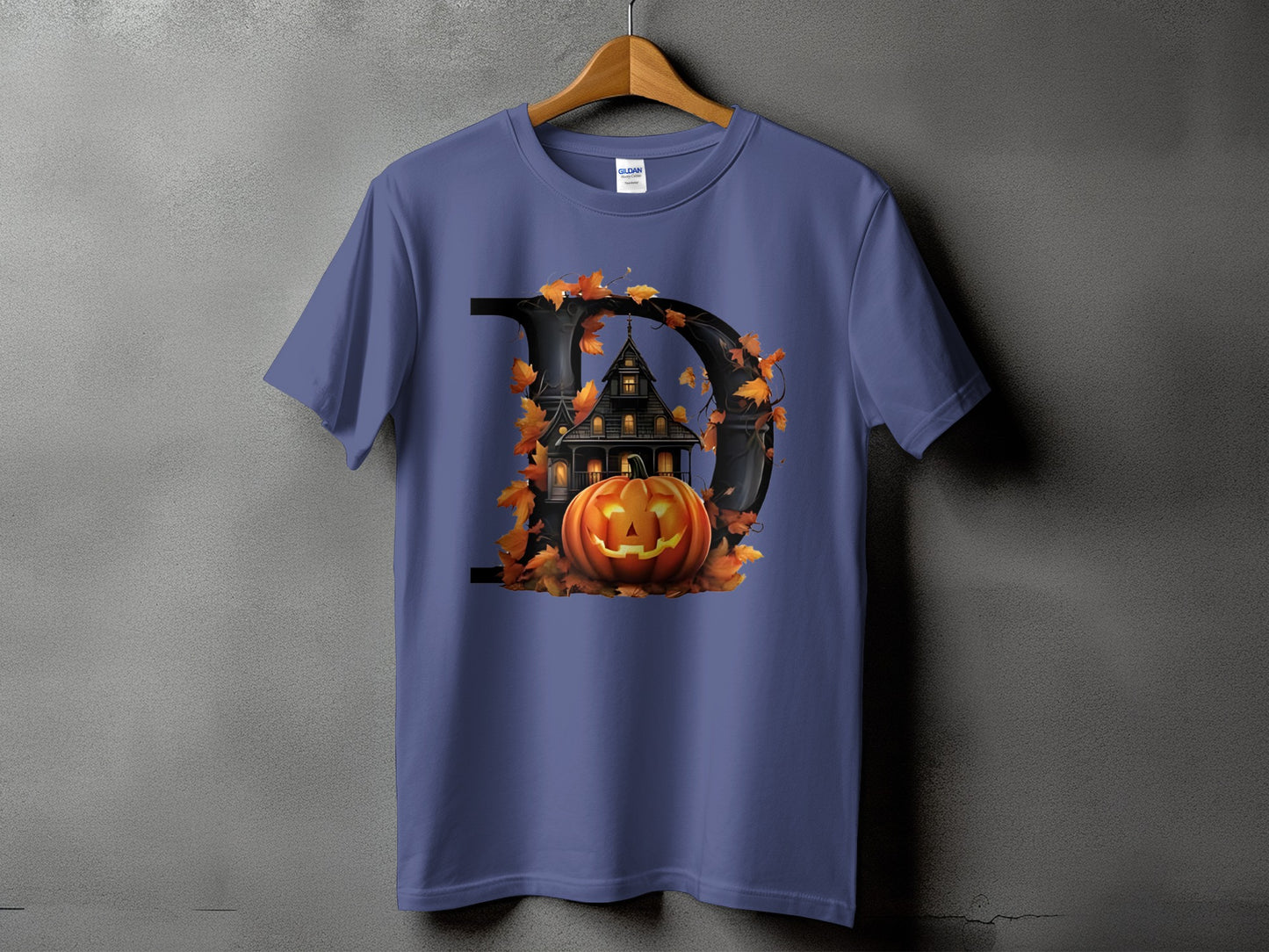 Halloween themed t-shirt with a large letter D, haunted house, and jack-o'-lantern.