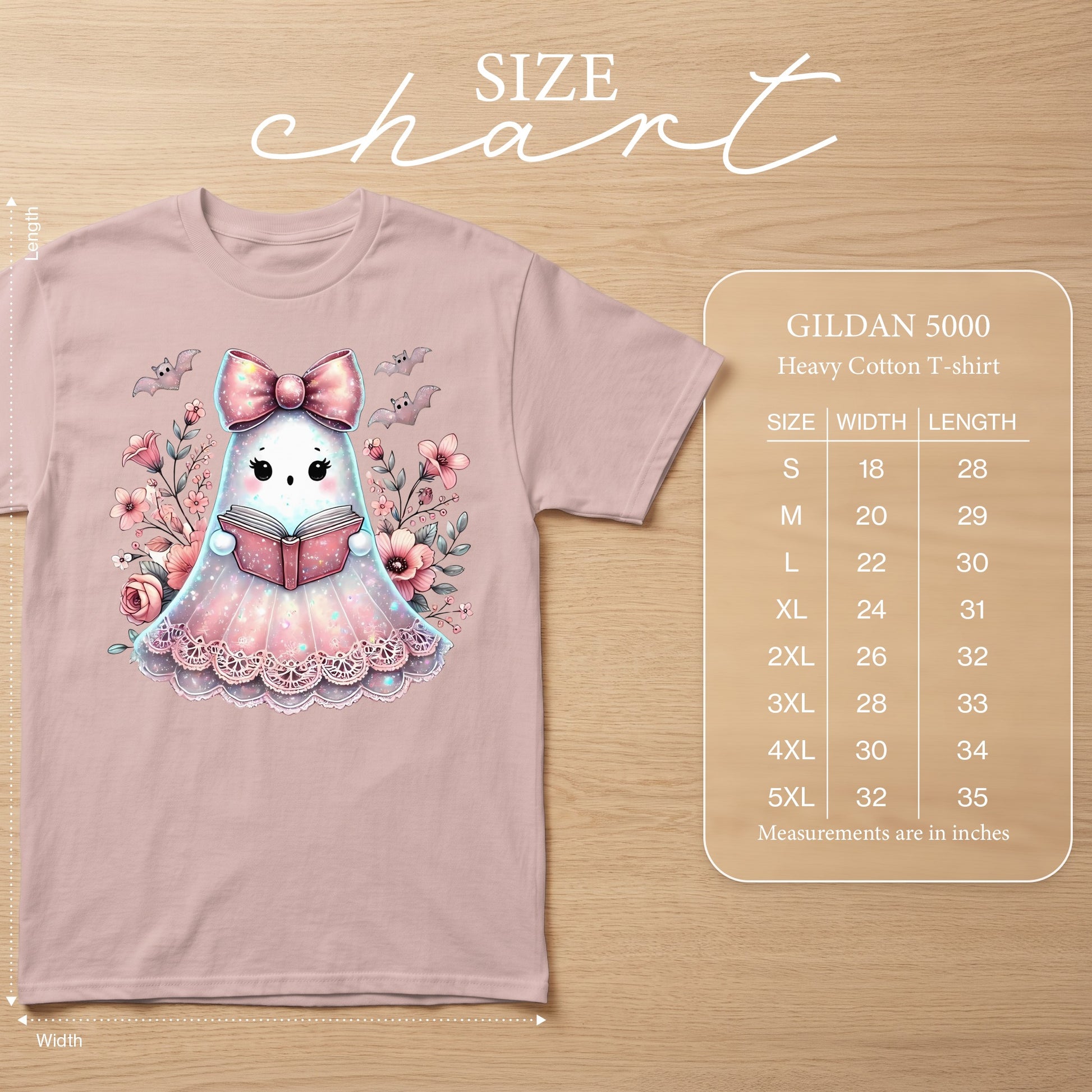 Pink t-shirt with a cute ghost reading a book with floral and bat graphics. Includes size chart.