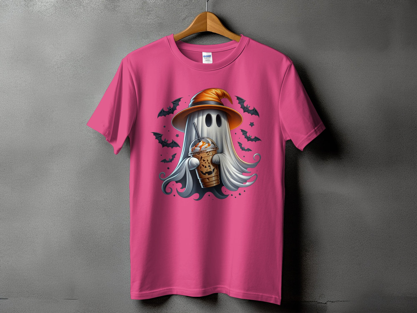 Pink t-shirt with a ghost wearing a witch hat holding a caramel latte.