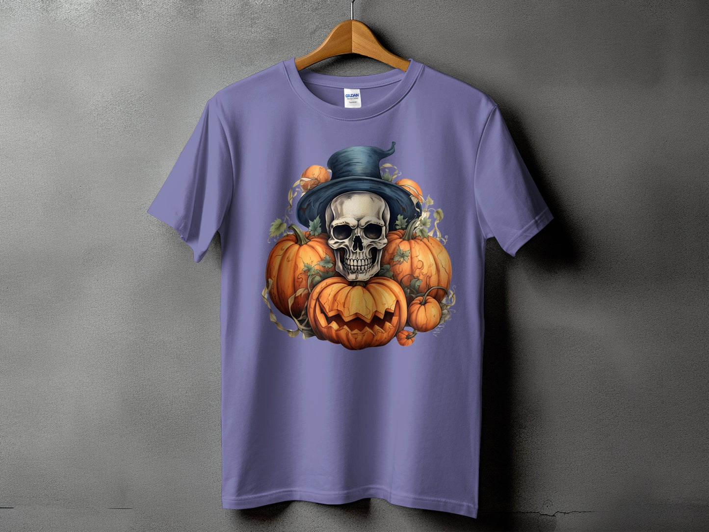 Skull wearing witch hat with pumpkins and vines on a purple t-shirt.