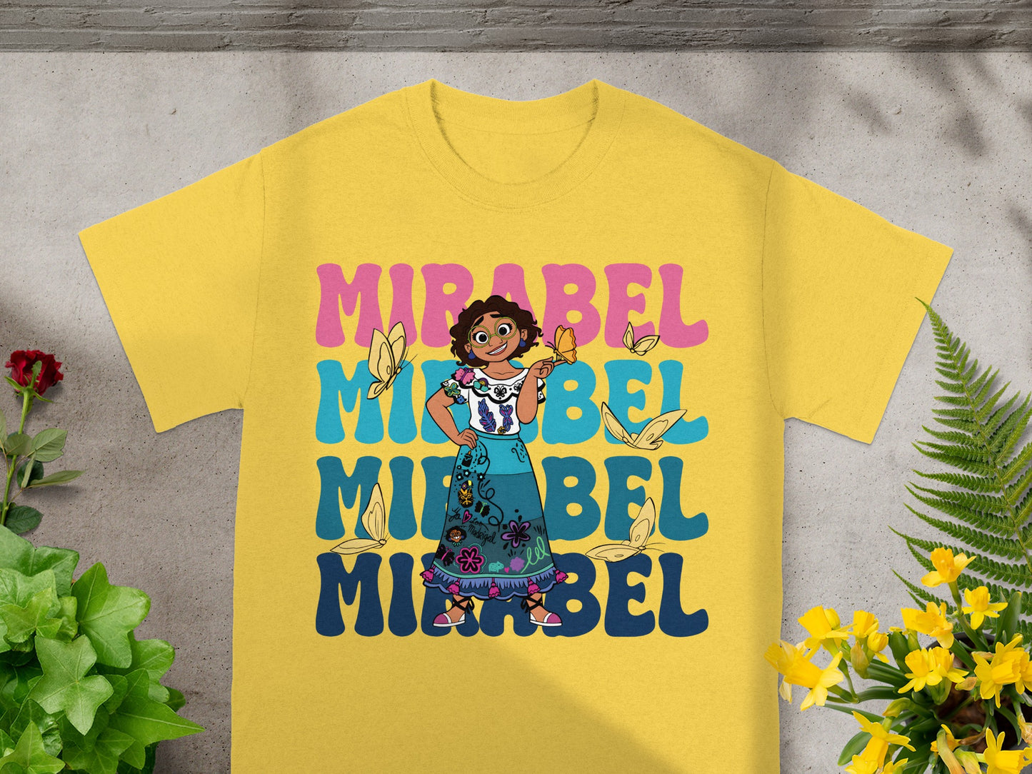 Yellow t-shirt with Mirabel Madrigal graphic and butterflies.