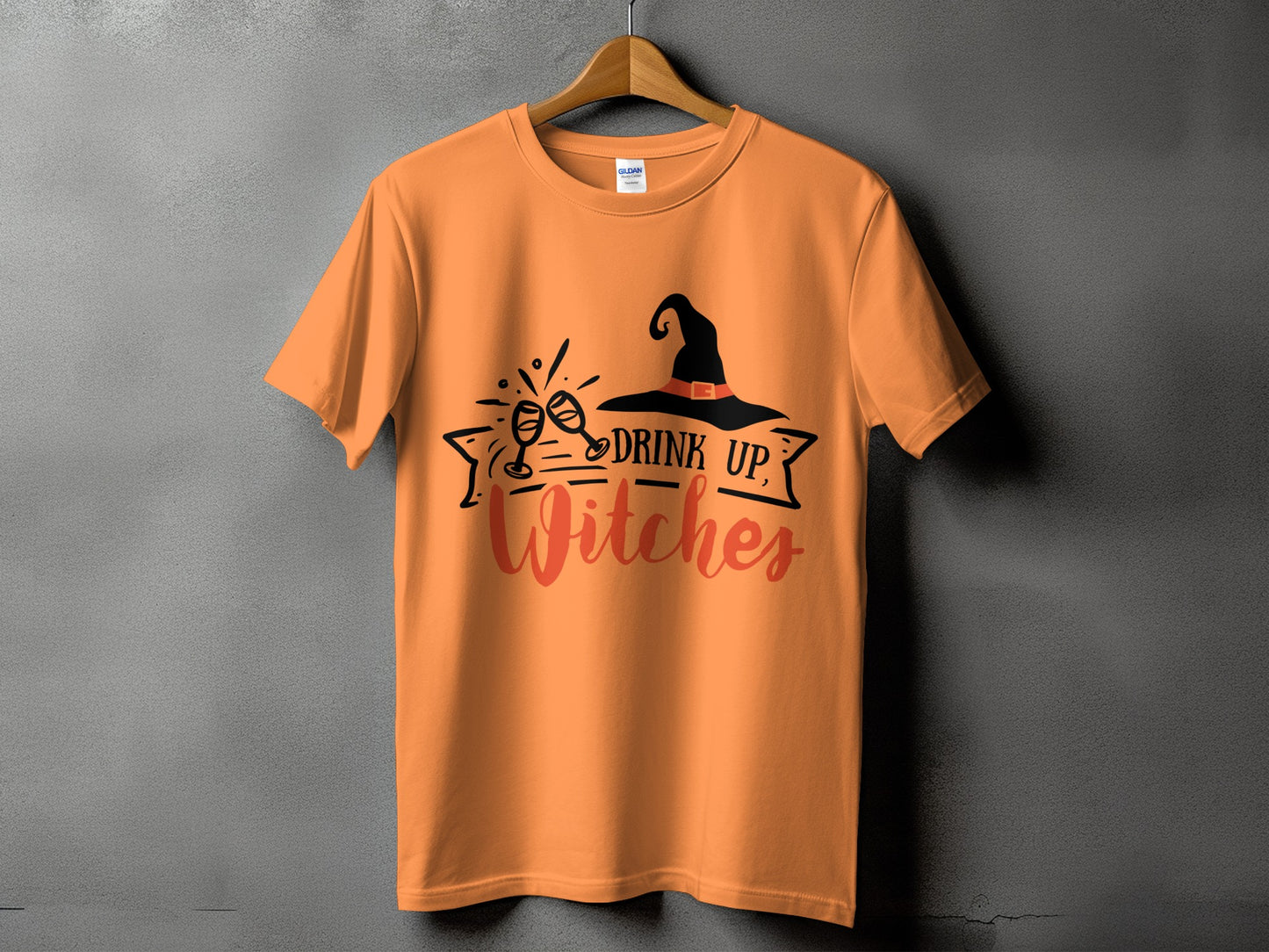 Orange t-shirt with "Drink Up Witches" text and witch hat graphic.