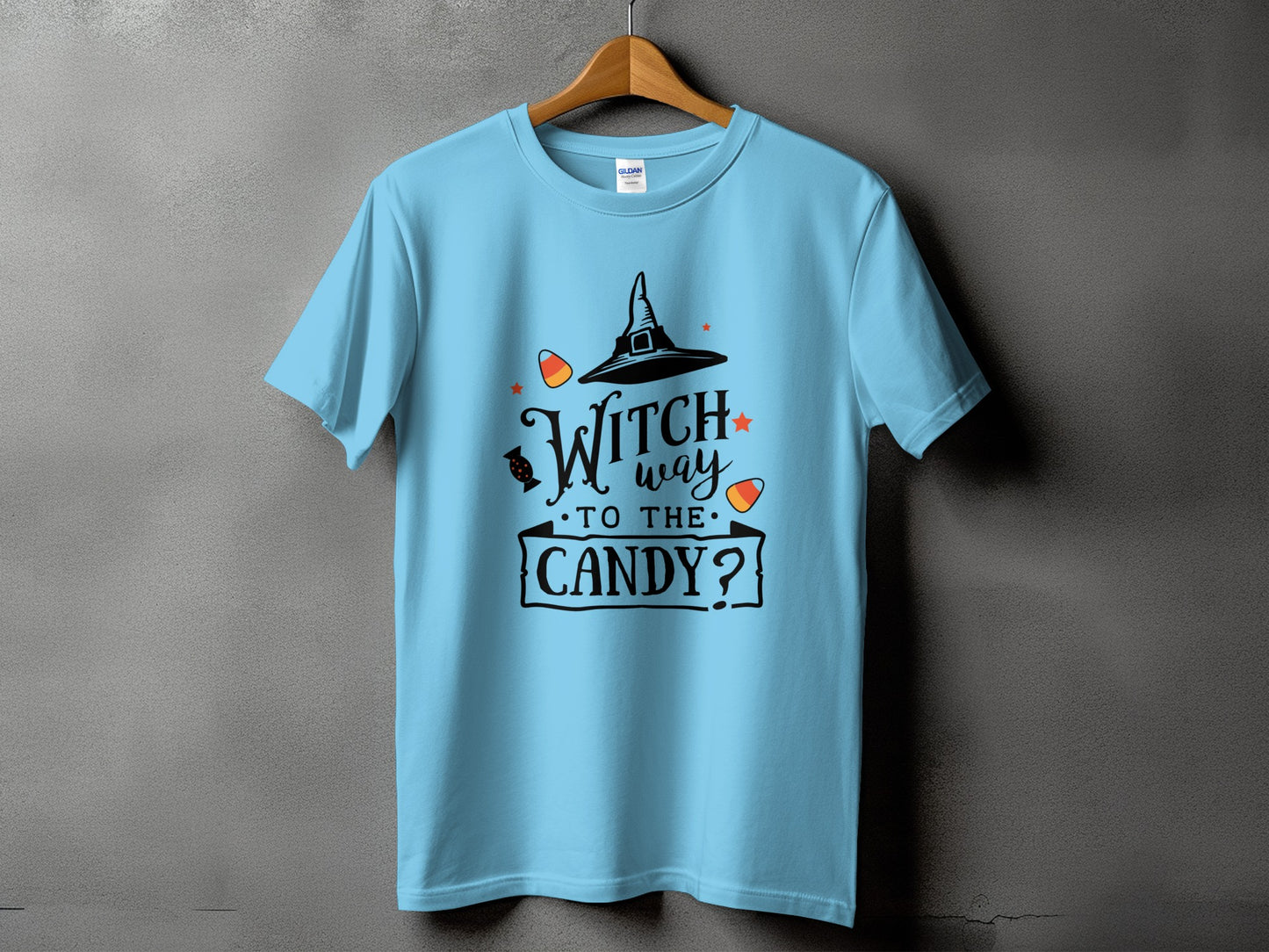 Light blue t-shirt with "Witch way to the candy?" Halloween graphic.