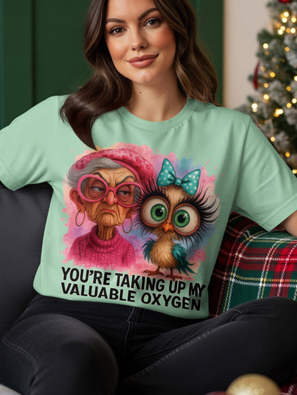 Mint t-shirt with watercolor illustration of an owl and an elderly woman.