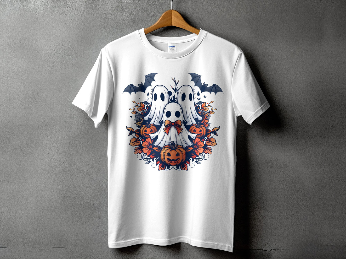 White t-shirt with a Halloween design featuring ghosts, bats, and pumpkins.