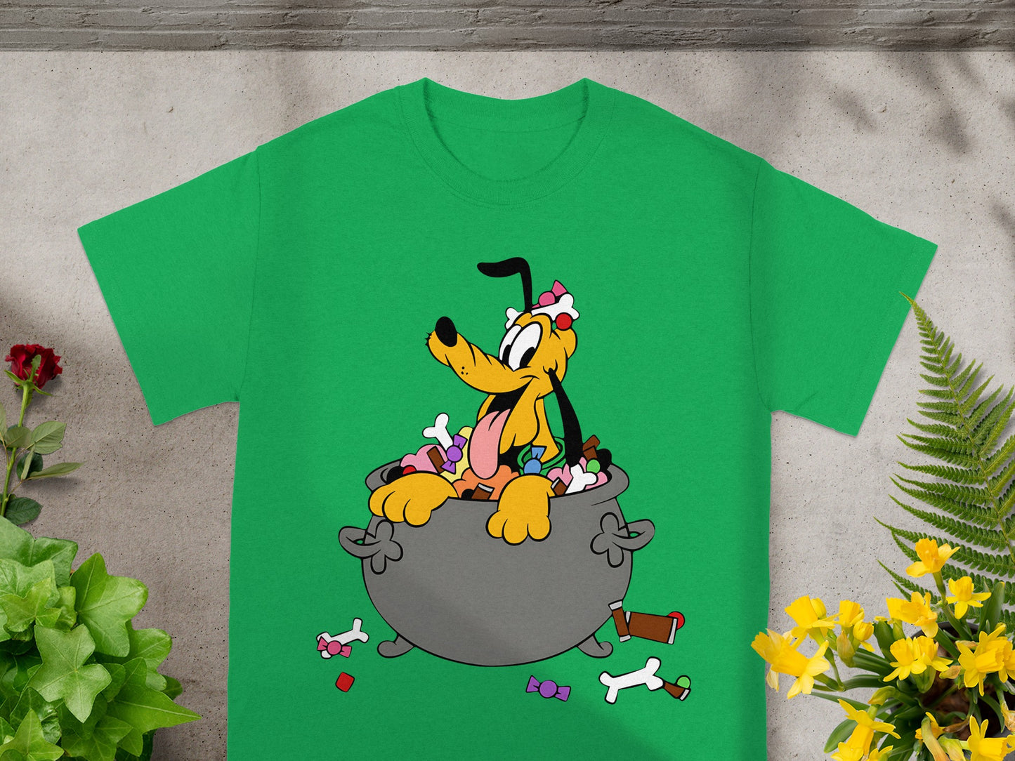 Pluto sits in a cauldron overflowing with candy and bones.