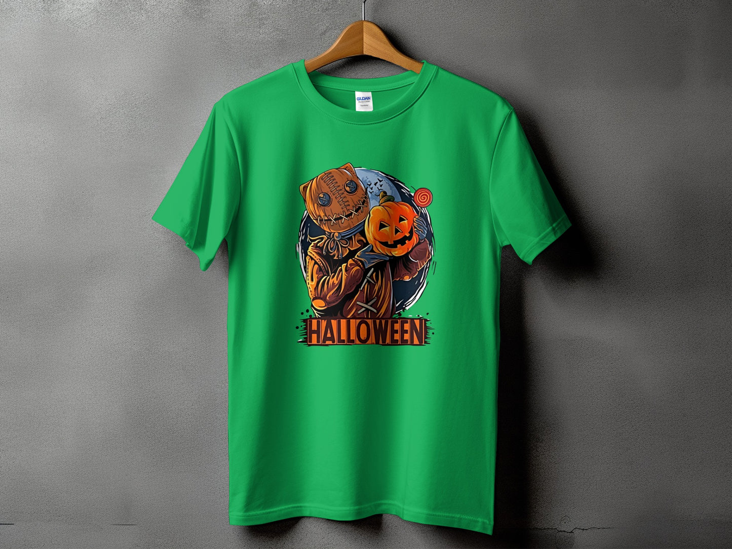 Green t-shirt with a pumpkin-headed character holding a jack-o'-lantern and the word Halloween.