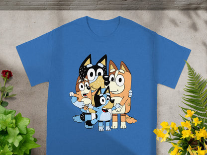 Blue t-shirt featuring cartoon dogs Bluey, Bingo, Bandit, and Chilli embracing.