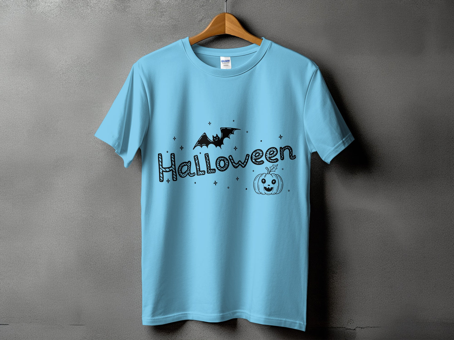 Light blue t-shirt with black Halloween text, a bat, and a jack-o'-lantern design.