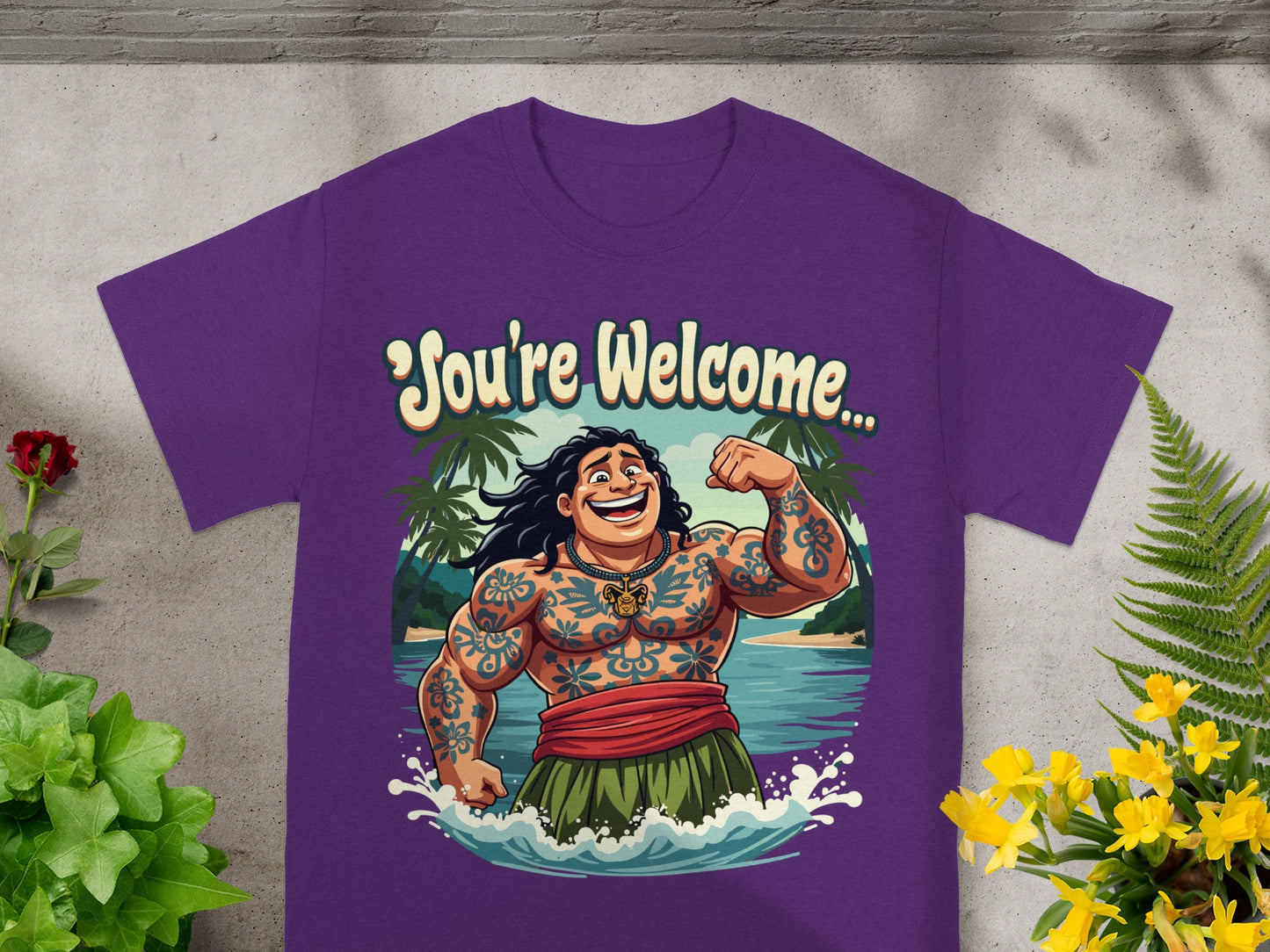 T-shirt graphic of Maui with text "You're Welcome..." in Polynesian island setting.
