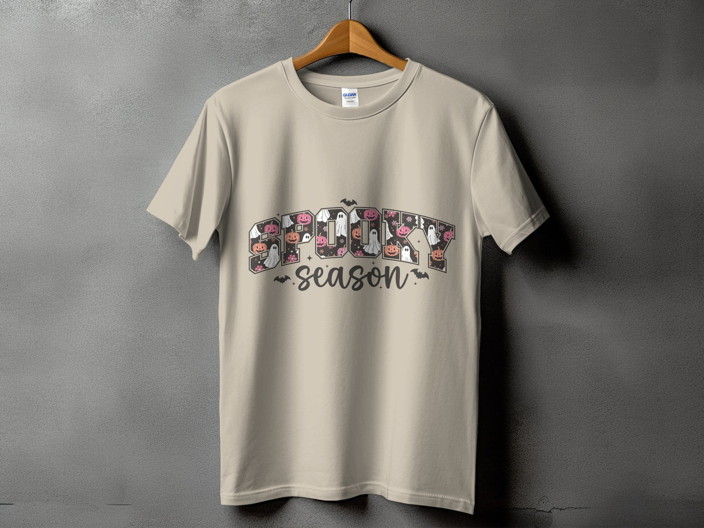 Light beige t-shirt with "SPOOKY SEASON" text and Halloween-themed graphics.