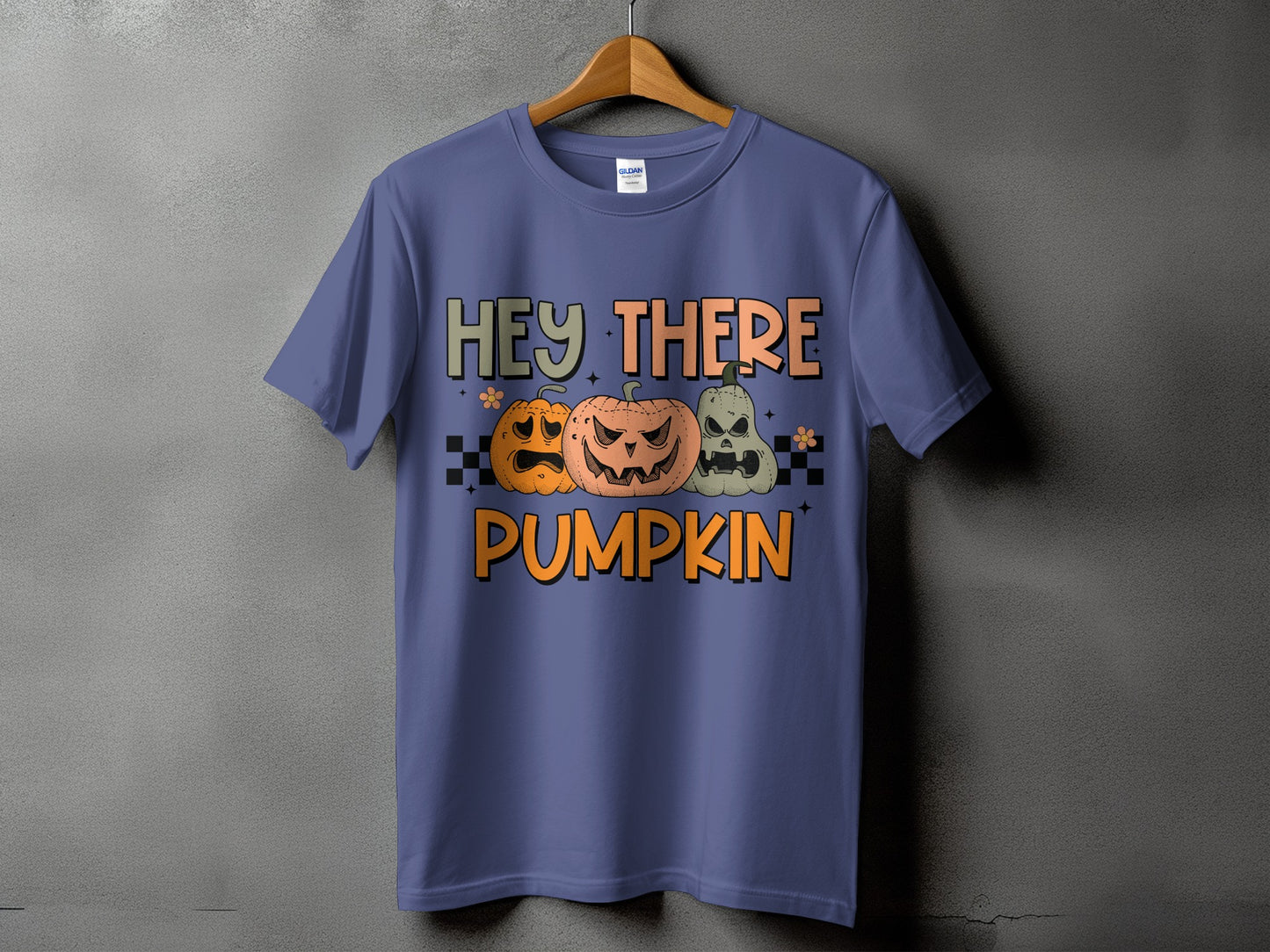 Purple t-shirt with "HEY THERE PUMPKIN" text and three Halloween pumpkins.