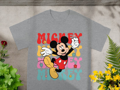 Mickey Mouse graphic t-shirt with colorful "Mickey" text and flowers.