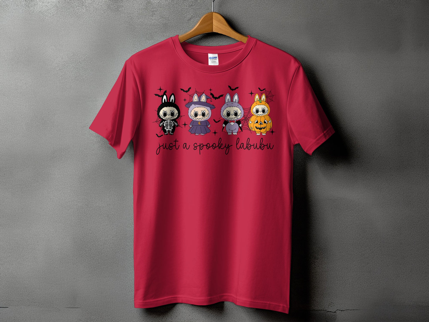 Red t-shirt with four Halloween-themed characters and the text "just a spooky labubu".