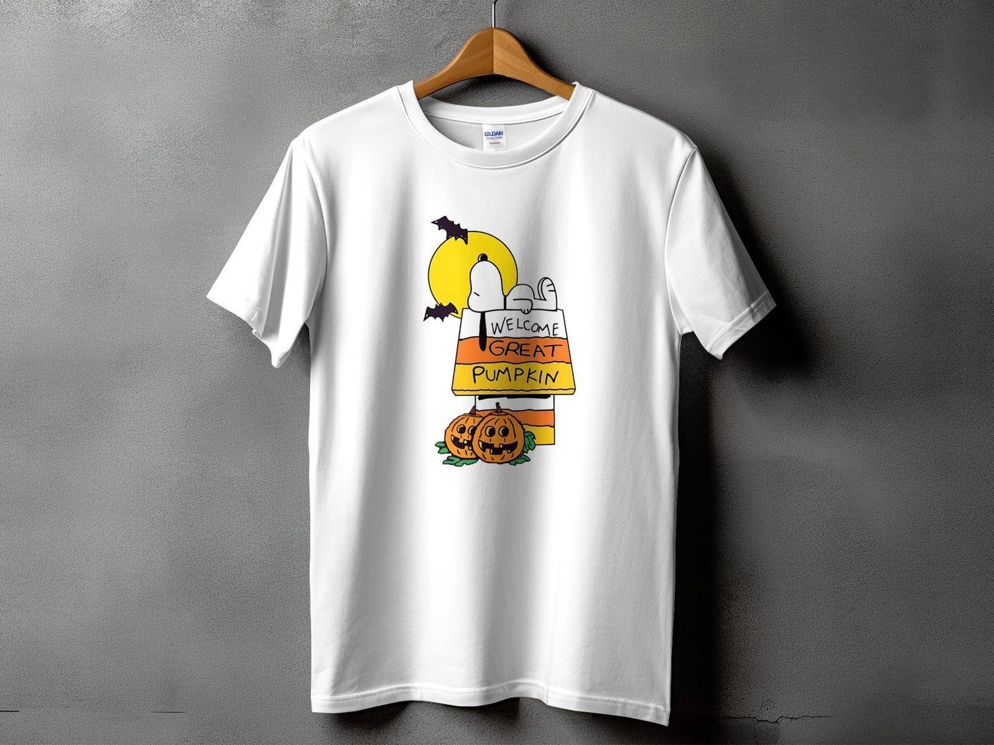 White t-shirt with Snoopy graphic, pumpkins, and "Welcome Great Pumpkin" text.