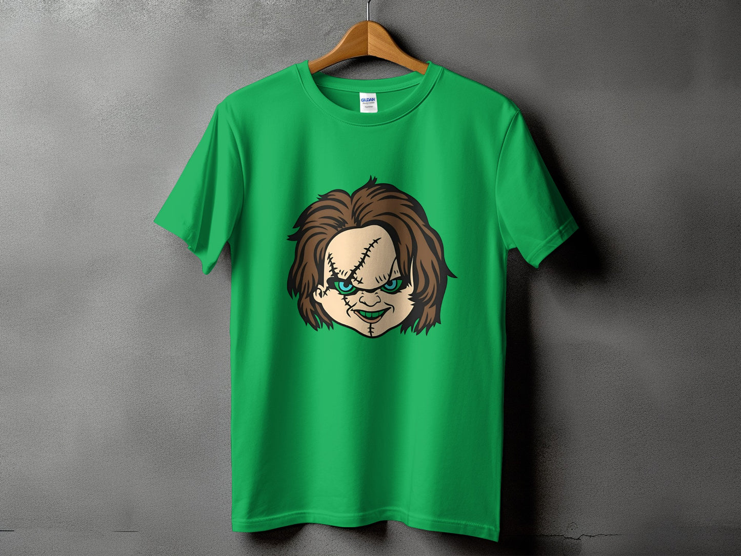 Green t-shirt with Chucky doll face graphic on front.