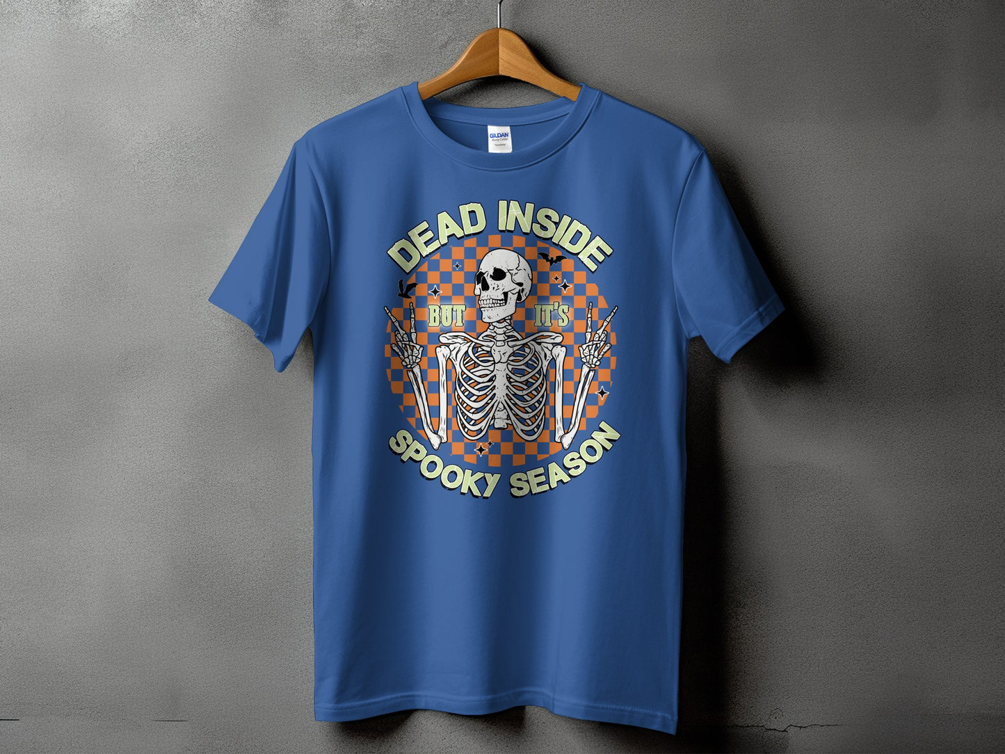 Blue t-shirt with a skeleton graphic and text "DEAD INSIDE BUT IT'S SPOOKY SEASON".