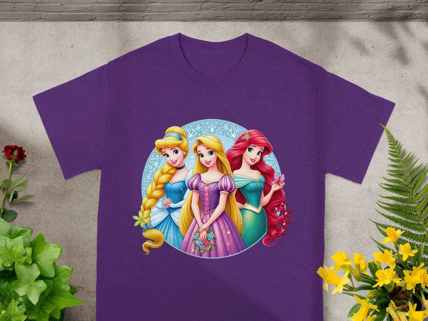 Purple t-shirt with Ariel, Belle, and Rapunzel from Disney Princesses.