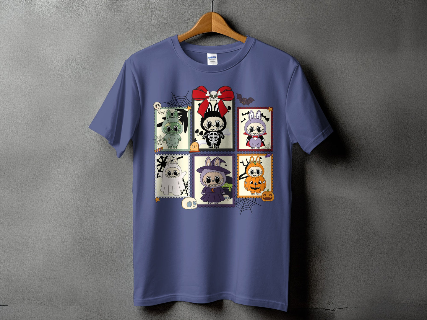 Purple t-shirt with six Halloween-themed stamp graphics featuring cartoon monsters.