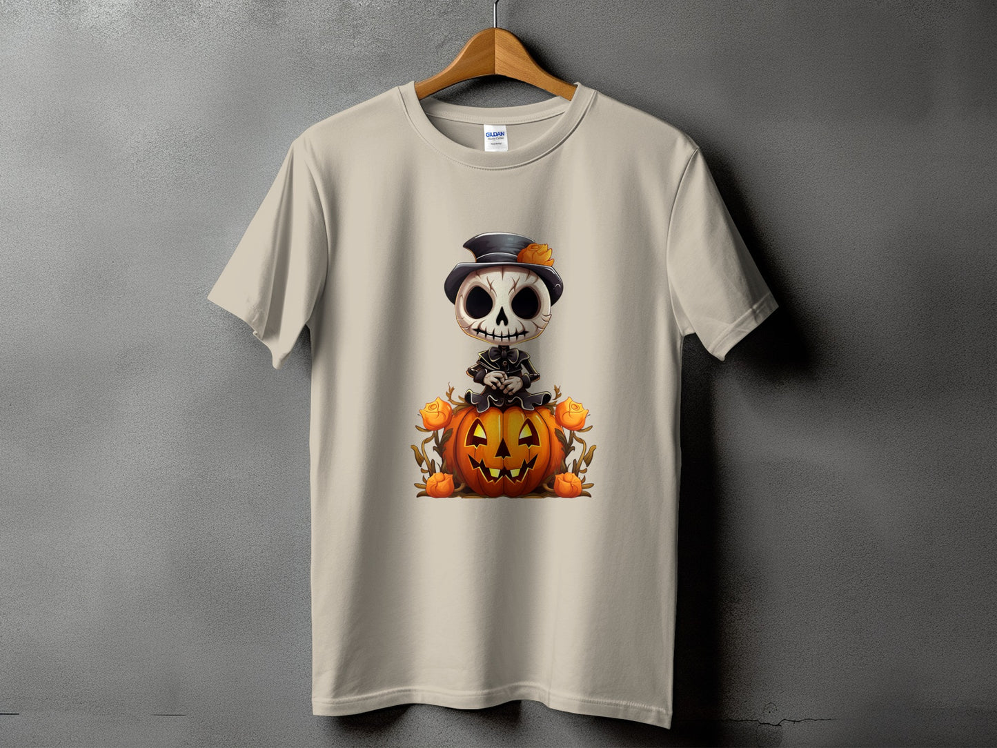 Light tan t-shirt with a cartoon skeleton sitting on a jack-o'-lantern.