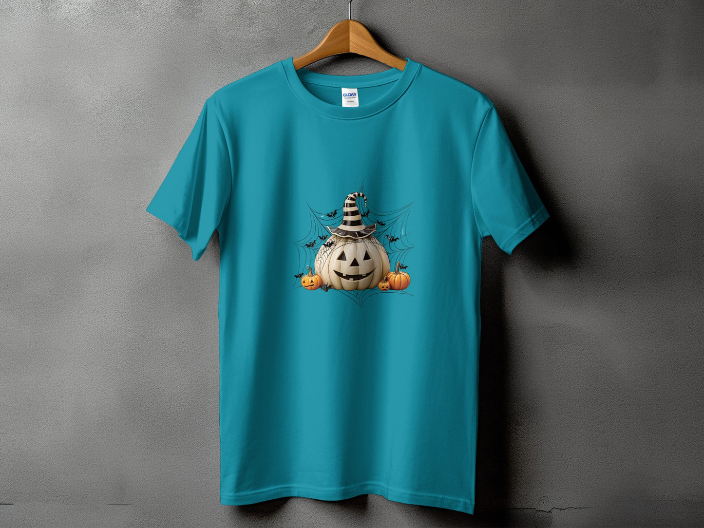 Teal t-shirt with Halloween pumpkin graphic and bats on a spiderweb.