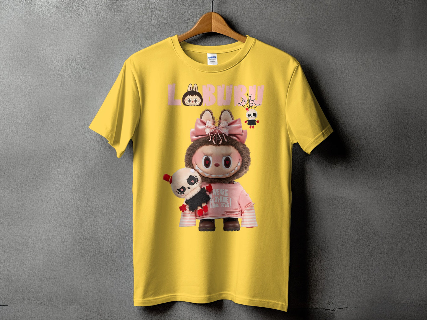 Yellow t-shirt with Labubu graphic and panda plush toy.