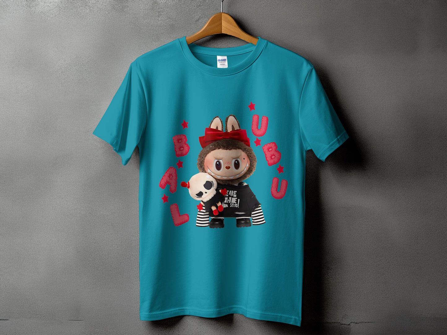 Teal t-shirt with Bubbu character graphic and text "WE ARE THE MONSTERS!"