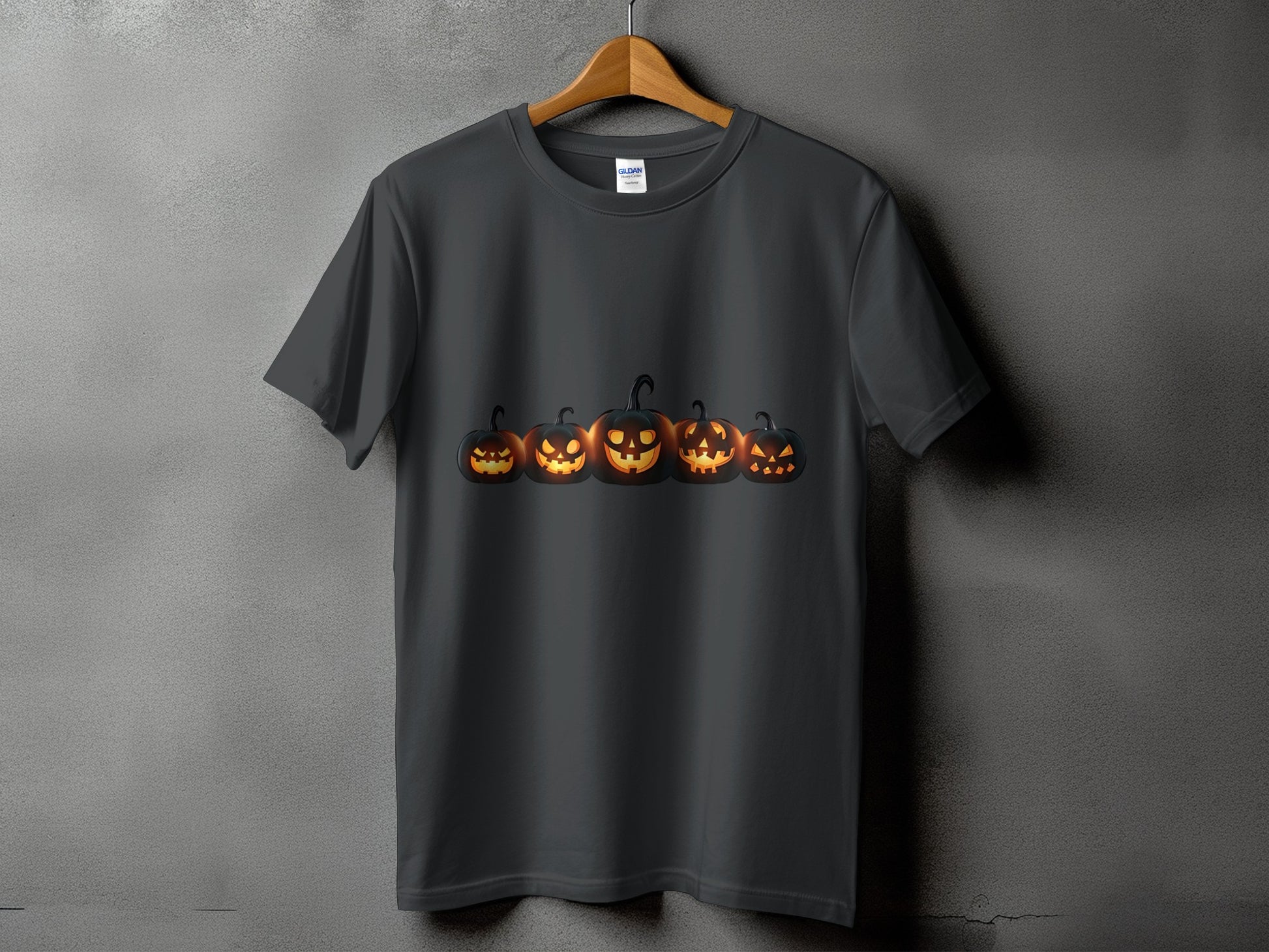 Dark gray t-shirt with a row of glowing Jack-o'-lanterns on the front.