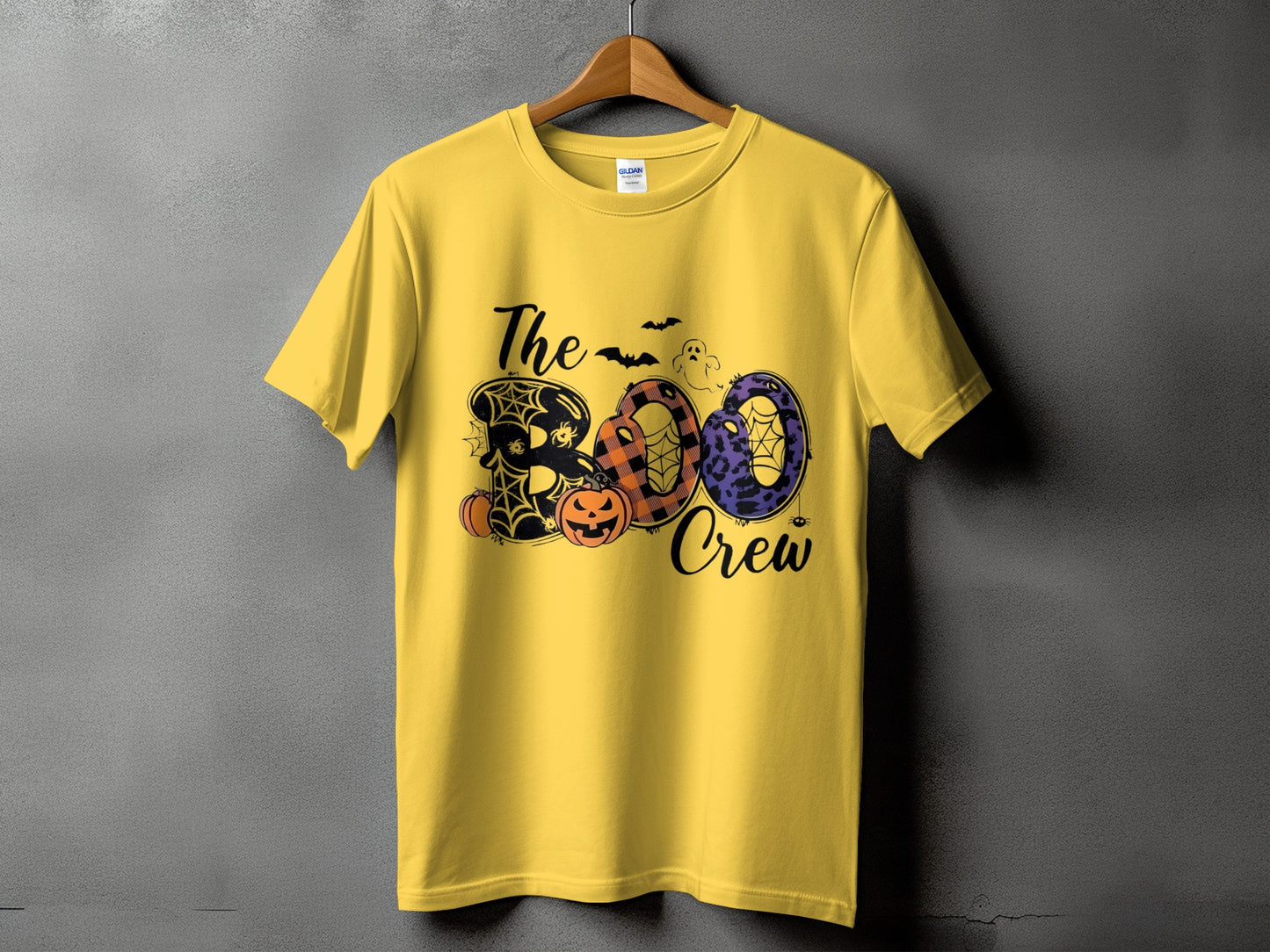 Yellow t-shirt with "The Boo Crew" Halloween graphic featuring pumpkins and bats.
