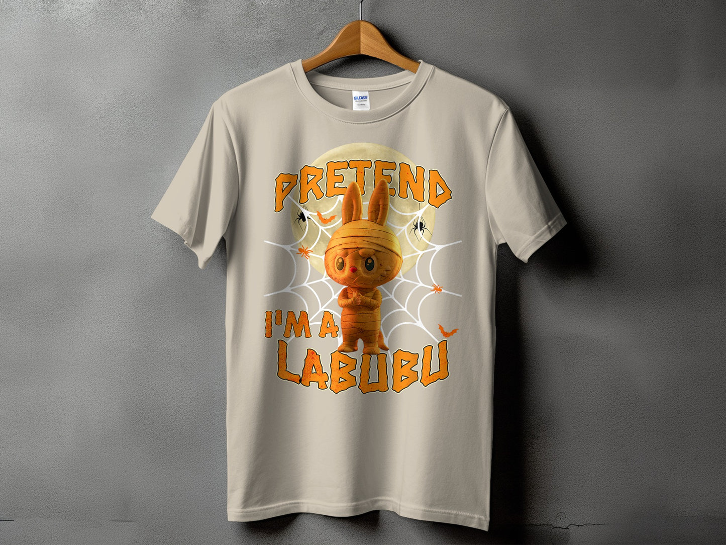 Light tan t-shirt with mummy Labubu graphic and text.