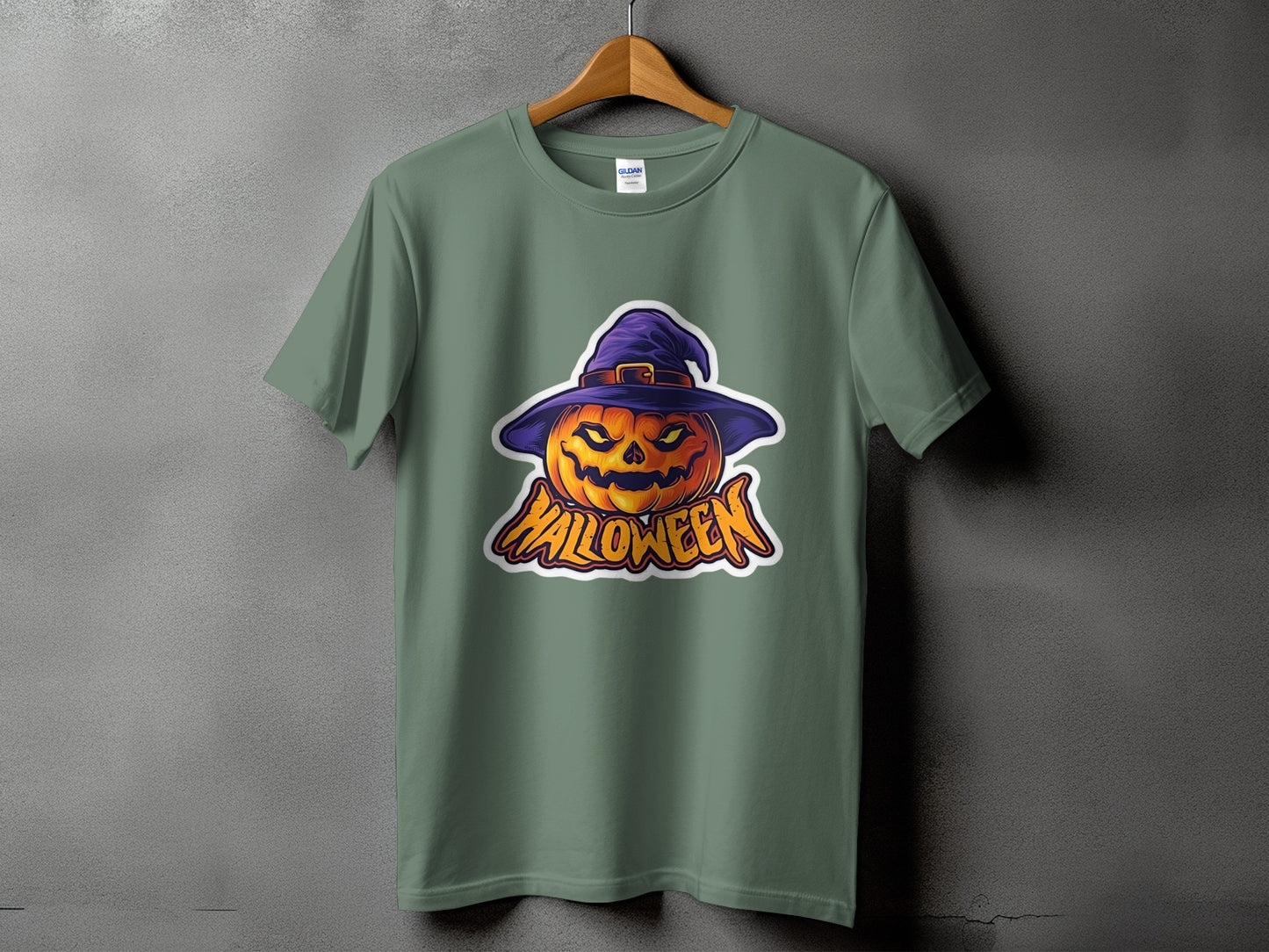 Green t-shirt with a cartoon jack-o'-lantern wearing a purple witch hat and the word Halloween.