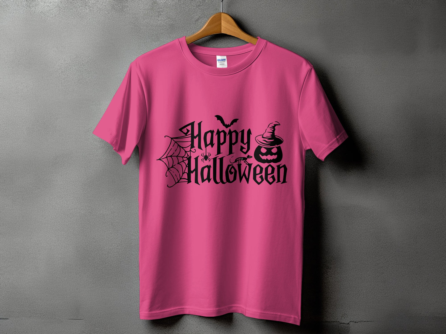 Pink t-shirt with black Halloween text, pumpkin, spider, bat, and cobweb design.