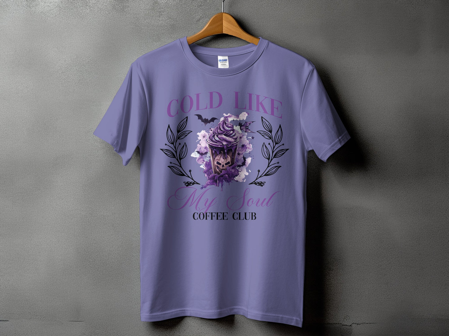 Purple t-shirt with "Cold Like My Soul Coffee Club" and skull coffee cup graphic.