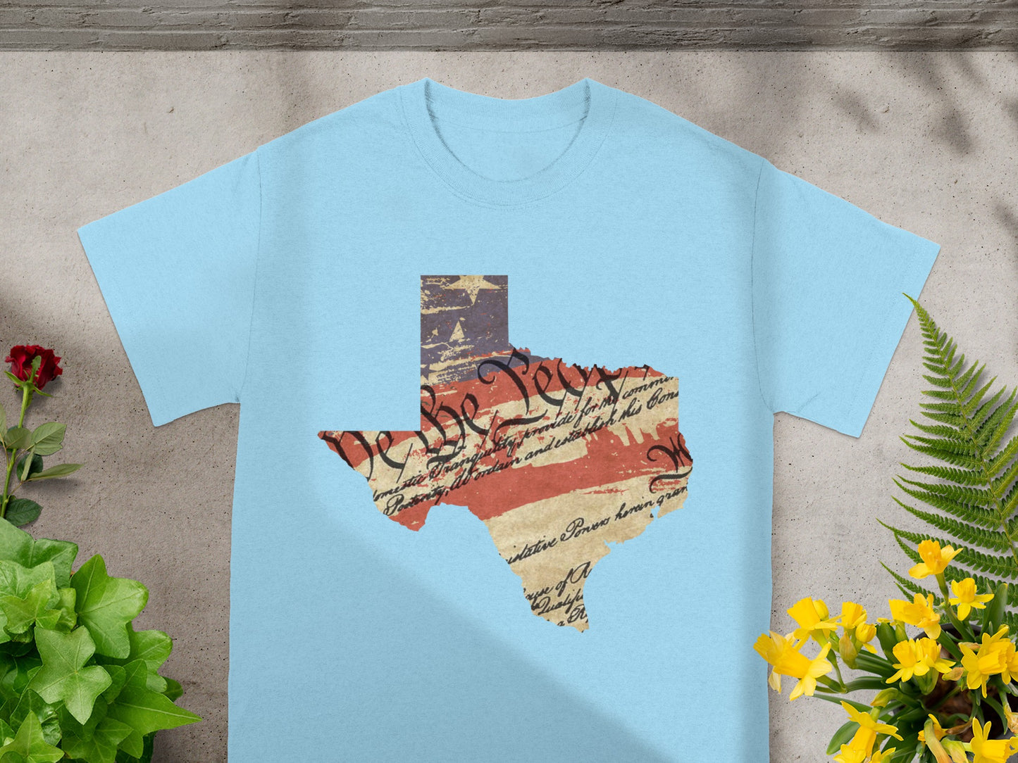 Light blue t-shirt with Texas outline featuring US Constitution text and flag.