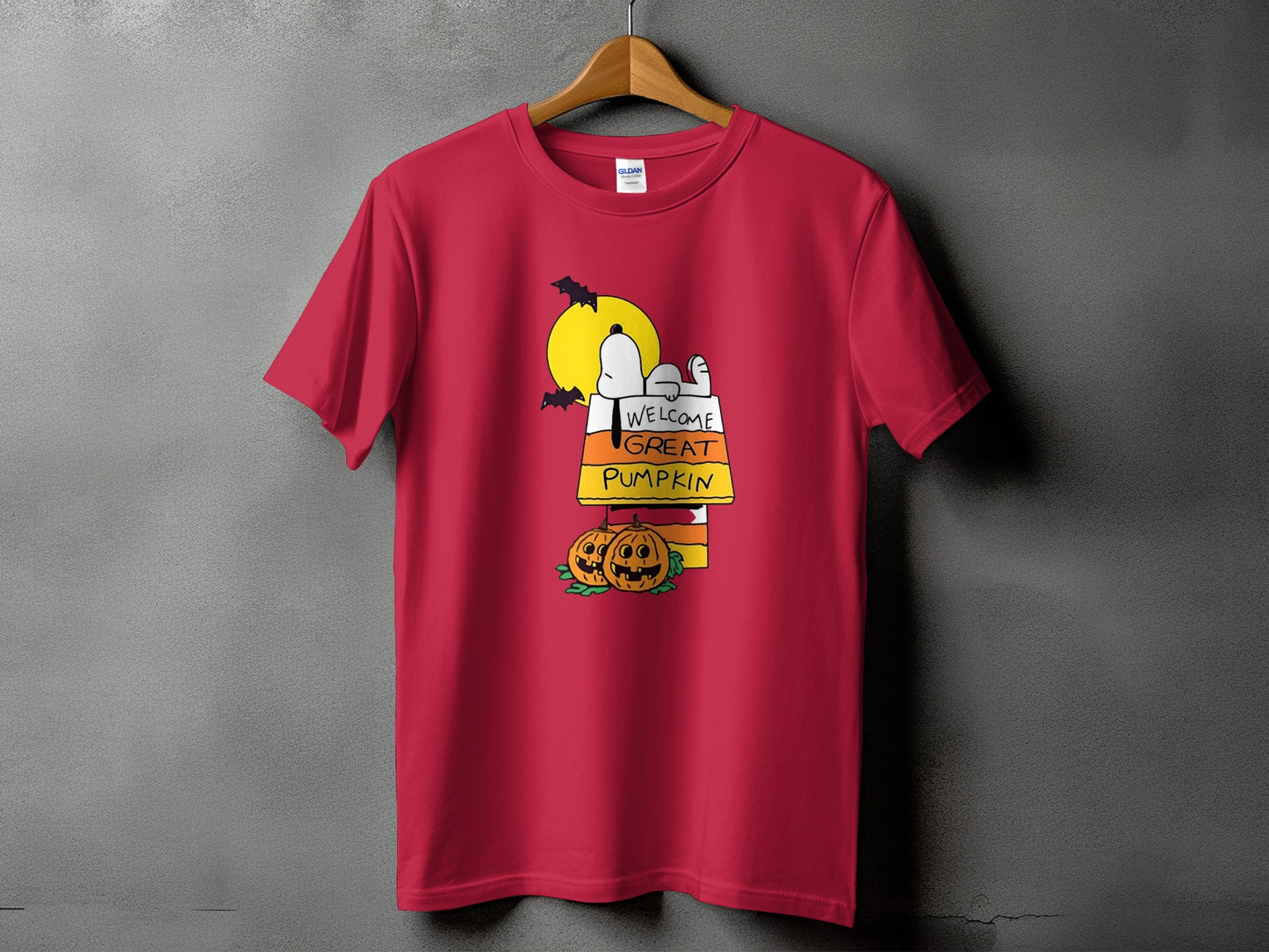 Red t-shirt with Snoopy and pumpkins graphic saying "Welcome Great Pumpkin".