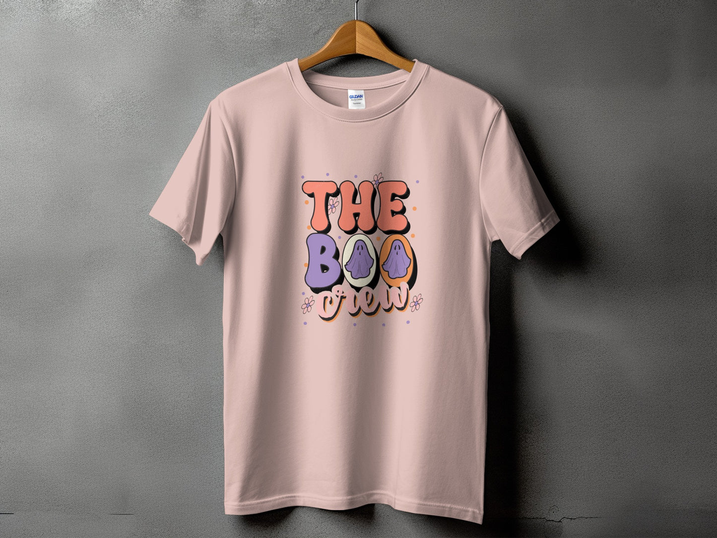 Pink t-shirt with "The Boo Crew" Halloween graphic featuring ghosts.