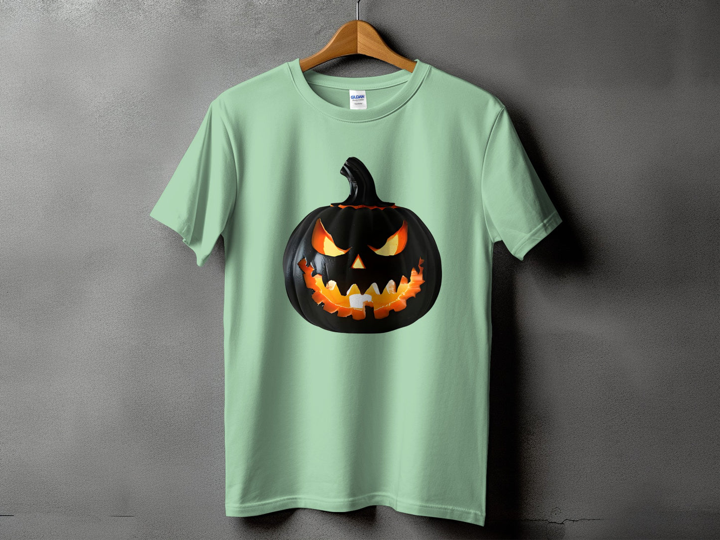 Green t-shirt with a black jack-o'-lantern graphic on the front.