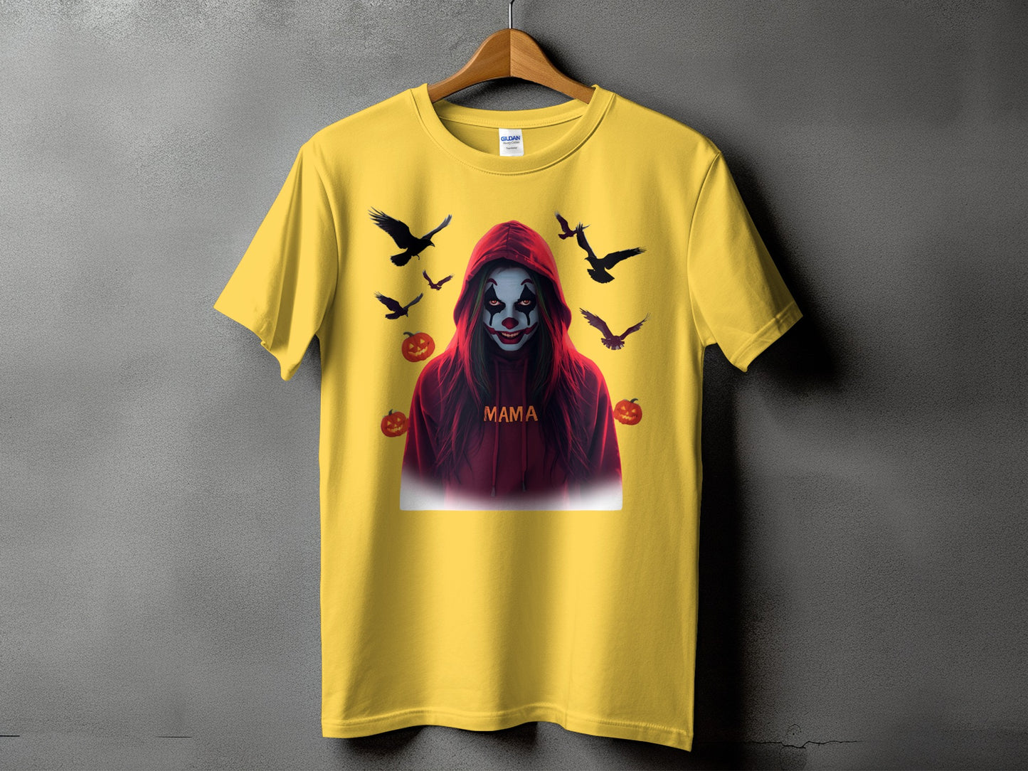 Yellow t-shirt with a clown, crows, and pumpkins graphic that says "MAMA".