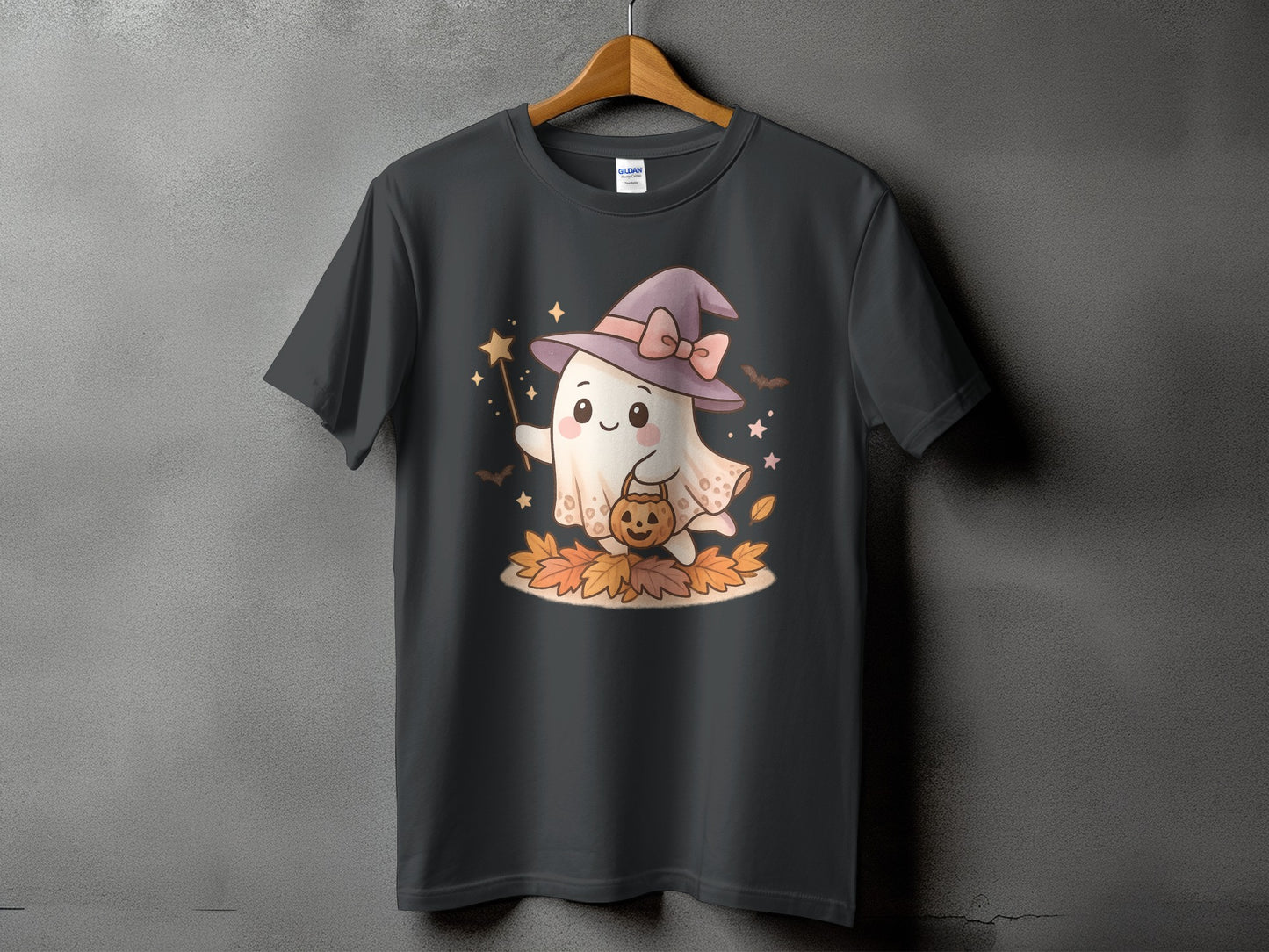 Ghost with witch hat and pumpkin trick-or-treat bucket on autumn leaves.